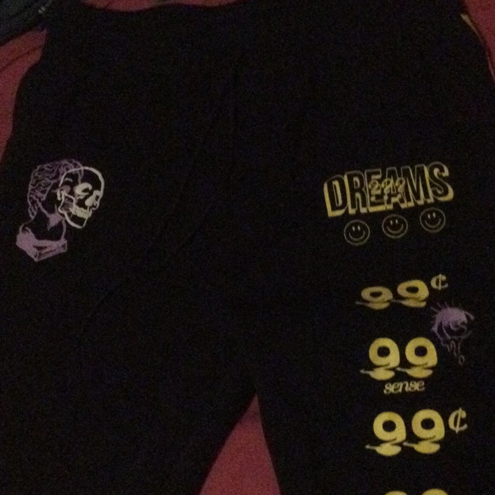 They are black with yellow and purple colored joggers